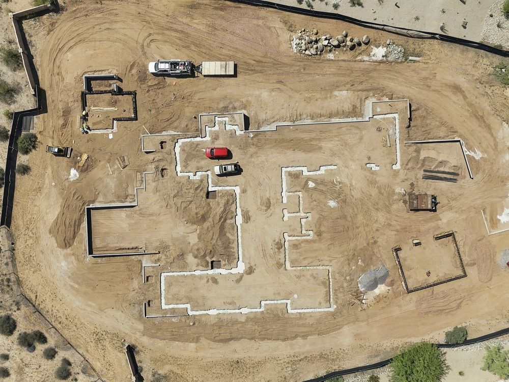 Drone top-down of foundation footings on a custom home site, Scottsdale
