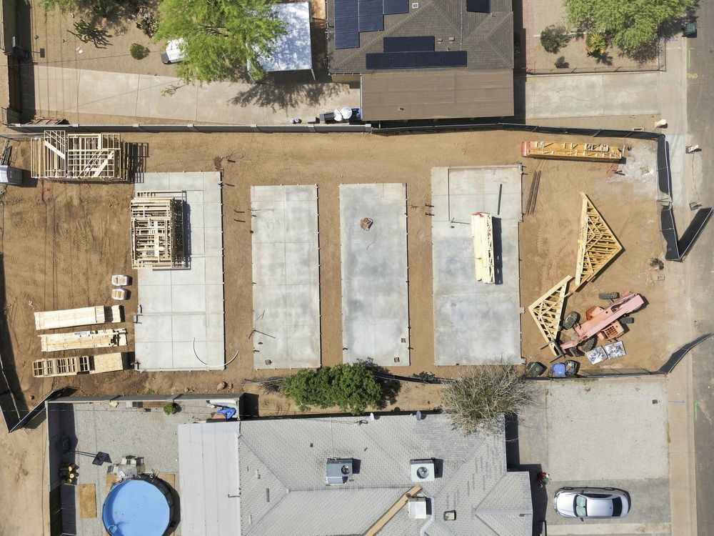 Top-down drone view of slabs for detached units behind existing homes, Coronado, Phoenix