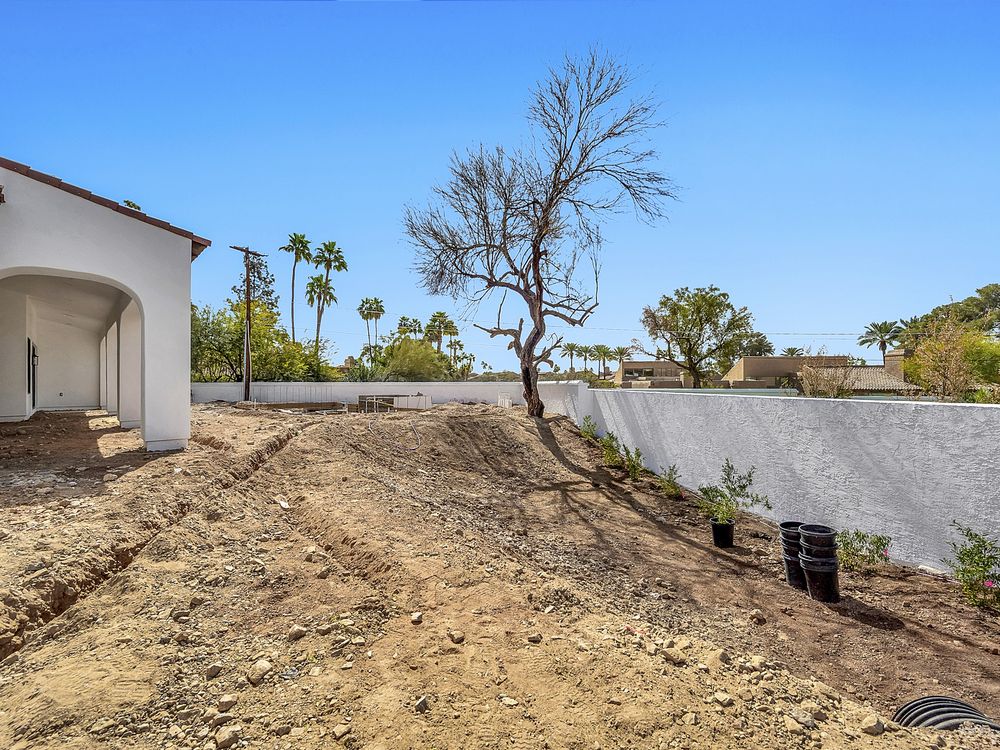 Dirt courtyard beside a Spanish style home, Arcadia, Phoenix