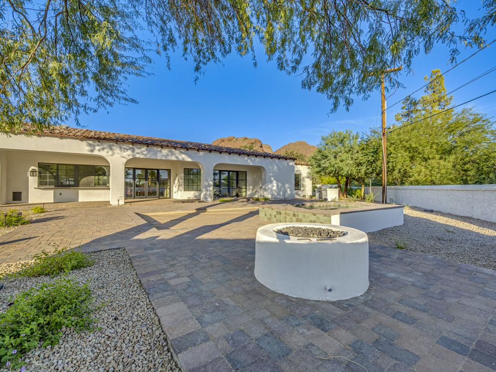 Same Arcadia courtyard finished with pavers and a fountain