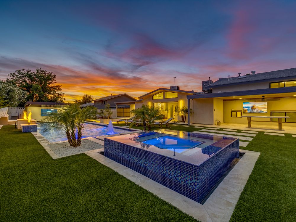 Pool and spa at twilight with lawn, Scottsdale
